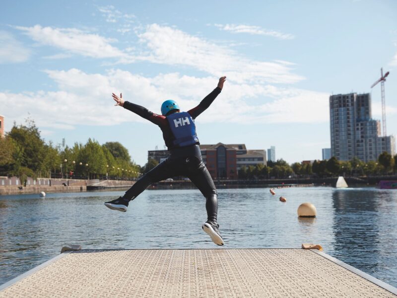 Man jumping into lake